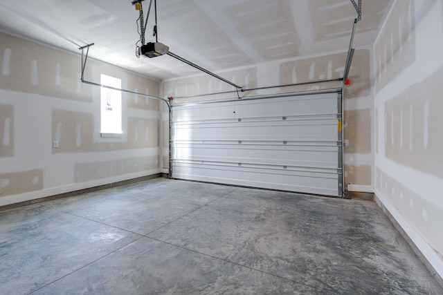 garage featuring baseboards and a garage door opener