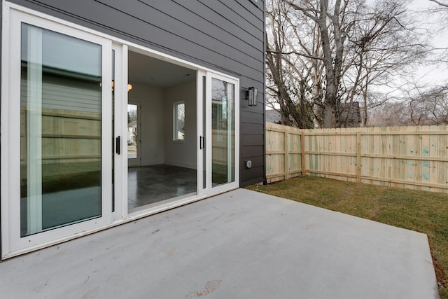 view of patio / terrace featuring fence