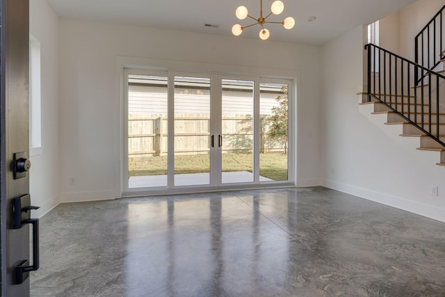 interior space featuring finished concrete floors, visible vents, baseboards, stairs, and an inviting chandelier