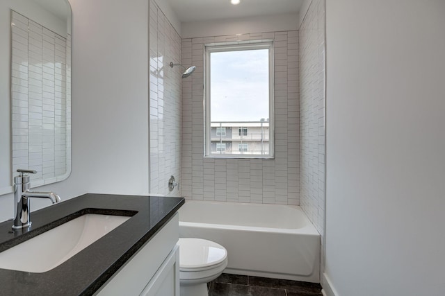 full bath with shower / bathing tub combination, vanity, toilet, and tile patterned floors