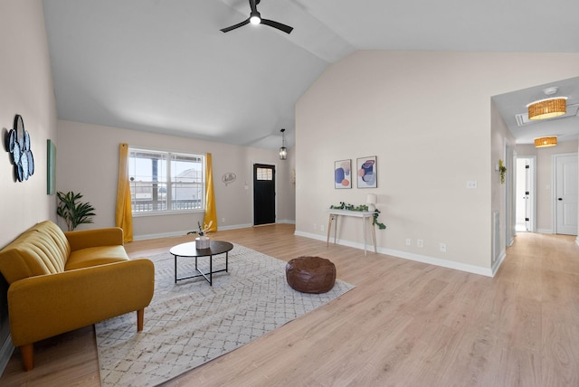 living area with high vaulted ceiling, ceiling fan, baseboards, and wood finished floors