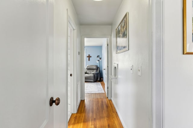 corridor with wood finished floors