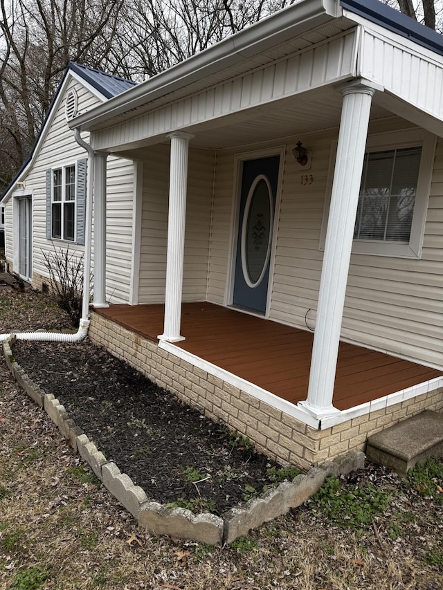 doorway to property with a porch