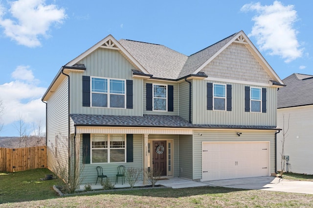 view of front of home with covered porch, concrete driveway, an attached garage, board and batten siding, and fence