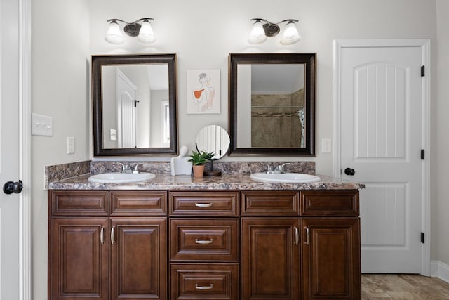 bathroom featuring double vanity and a sink