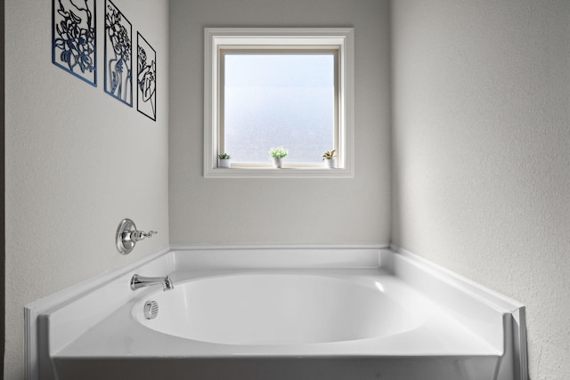 bathroom featuring a garden tub