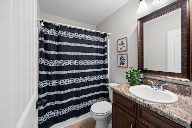 bathroom featuring a shower with shower curtain, vanity, and toilet