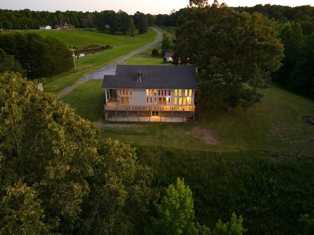 bird's eye view with a rural view and a wooded view