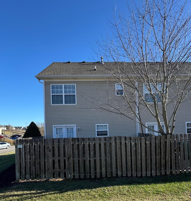 view of home's exterior featuring fence