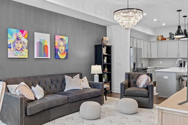 living area with a chandelier, recessed lighting, and light wood finished floors