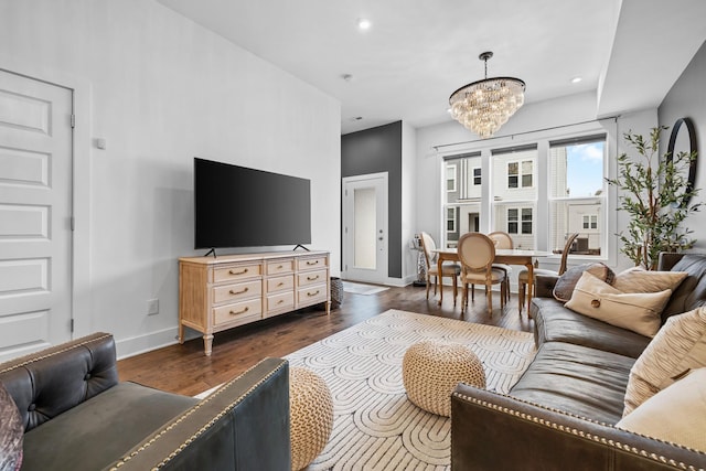 living room with recessed lighting, dark wood-style flooring, baseboards, and an inviting chandelier