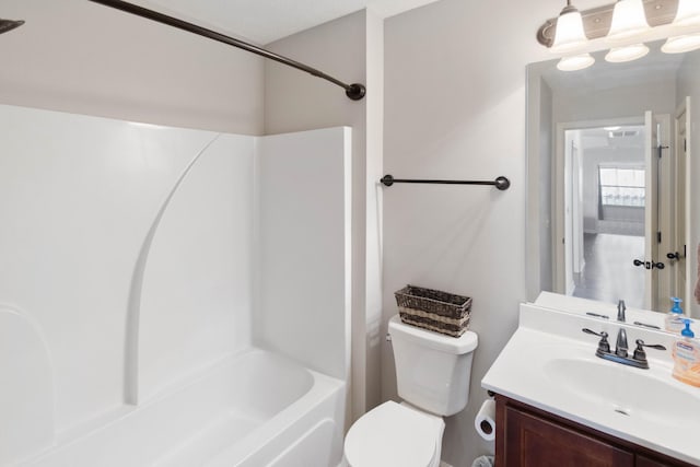 bathroom featuring shower / tub combination, vanity, and toilet