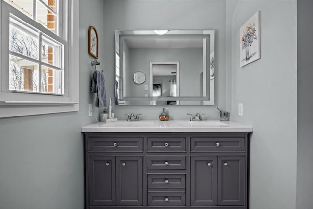 bathroom featuring double vanity and a sink