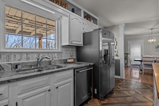 kitchen featuring a sink, stone countertops, white cabinetry, and dishwasher