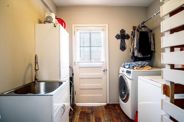 laundry area with a sink, cabinet space, dark wood-type flooring, and independent washer and dryer