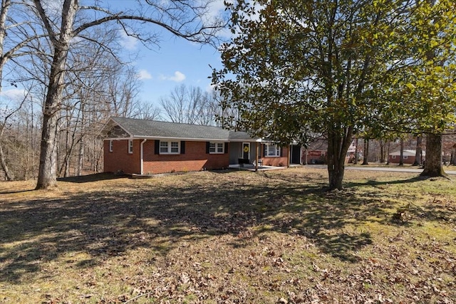 rear view of house featuring brick siding