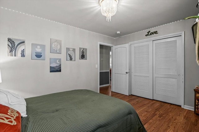 bedroom featuring a closet and wood finished floors