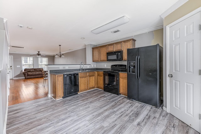 1382 Rural Hill Rd Unit 148, Antioch, TN 37013 - kitchen with open floor plan, black appliances, ornamental molding, and brown cabinets