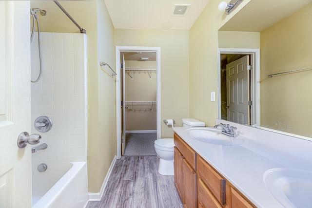 1382 Rural Hill Rd Unit 148, Antioch, TN 37013 - bathroom with double vanity, visible vents, toilet, wood finished floors, and a sink