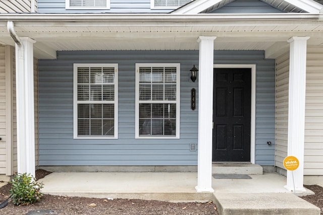 doorway to property with a porch