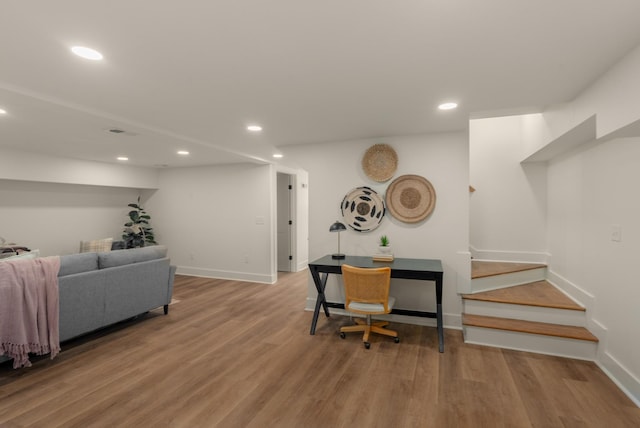 living room with stairway, recessed lighting, baseboards, and wood finished floors