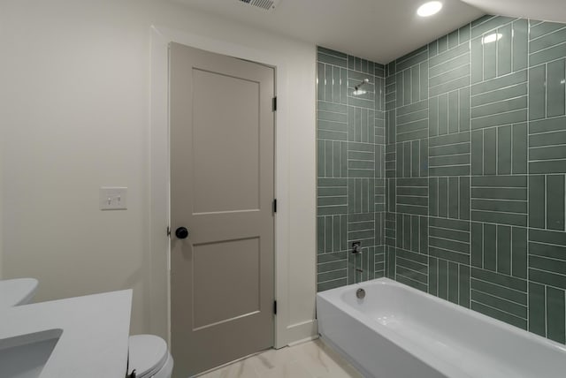 full bath featuring shower / tub combination, toilet, and a sink