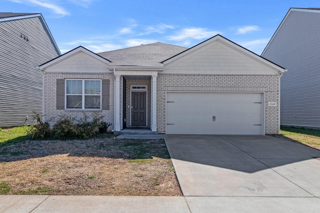 ranch-style house with brick siding, an attached garage, and driveway