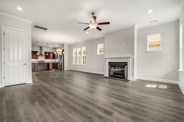 2053 Kirkwall Dr, Nolensville, TN 37135 - living room featuring a fireplace with flush hearth, visible vents, ornamental molding, and dark wood-style floors