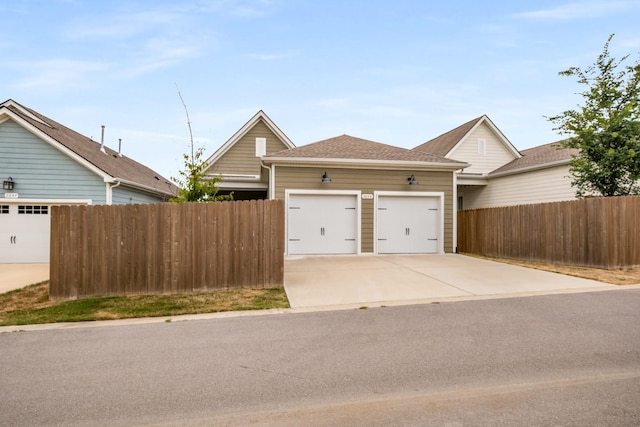 2053 Kirkwall Dr, Nolensville, TN 37135 - view of front of home featuring a shingled roof, concrete driveway, fence, and an attached garage