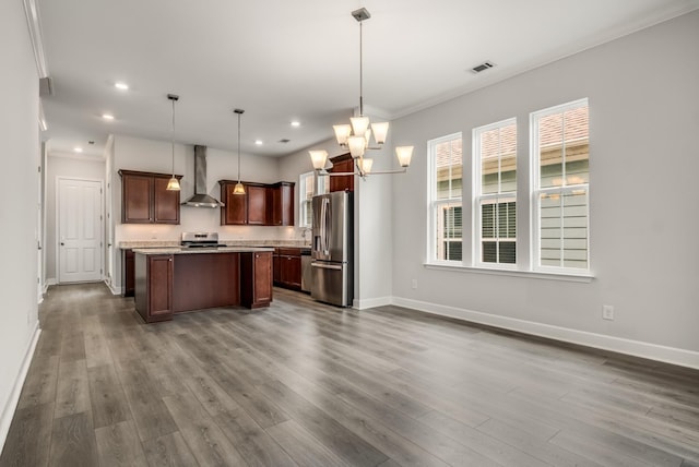 2053 Kirkwall Dr, Nolensville, TN 37135 - kitchen featuring dark wood-style flooring, light countertops, visible vents, appliances with stainless steel finishes, and wall chimney range hood