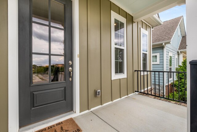 2053 Kirkwall Dr, Nolensville, TN 37135 - entrance to property with covered porch, a shingled roof, and board and batten siding