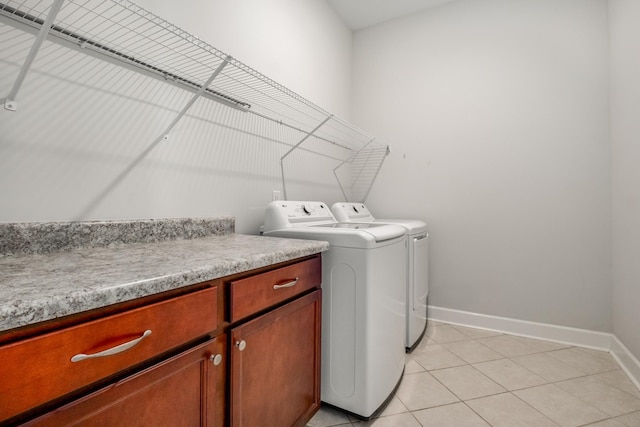 2053 Kirkwall Dr, Nolensville, TN 37135 - clothes washing area with light tile patterned floors, laundry area, baseboards, and washer and dryer