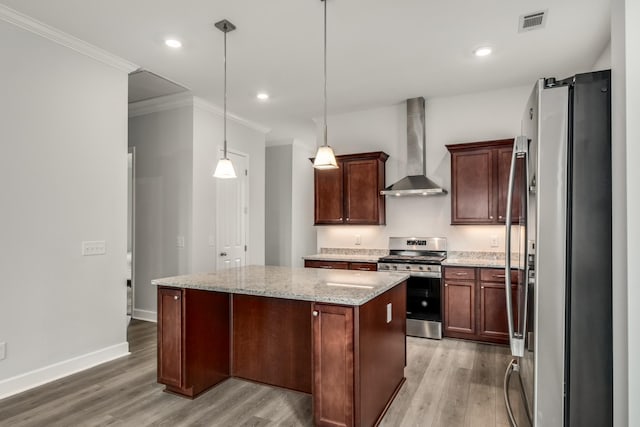 2053 Kirkwall Dr, Nolensville, TN 37135 - kitchen with a kitchen island, visible vents, appliances with stainless steel finishes, wall chimney range hood, and light wood-type flooring
