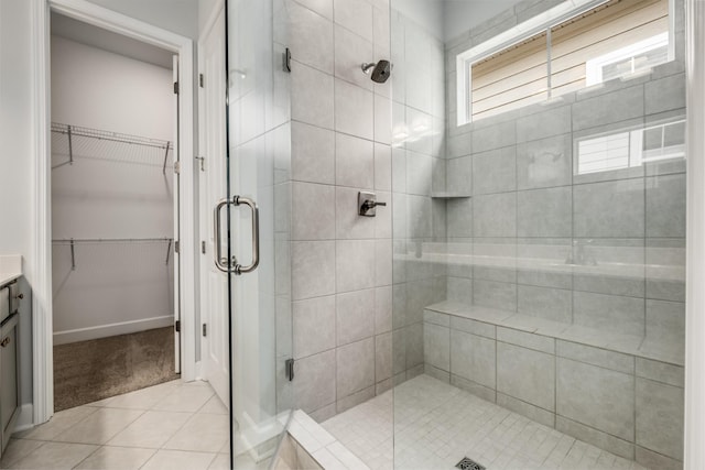 2053 Kirkwall Dr, Nolensville, TN 37135 - bathroom with a spacious closet, a stall shower, vanity, and tile patterned floors