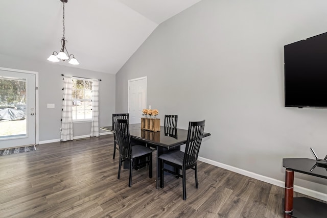 dining area featuring a notable chandelier, high vaulted ceiling, baseboards, and wood finished floors