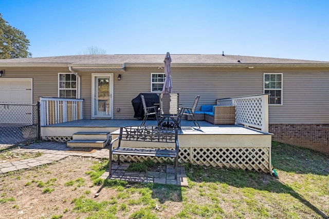 back of house featuring a wooden deck