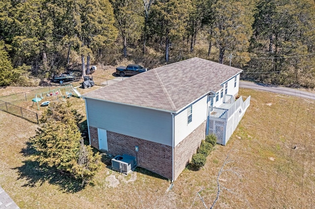 birds eye view of property featuring a view of trees