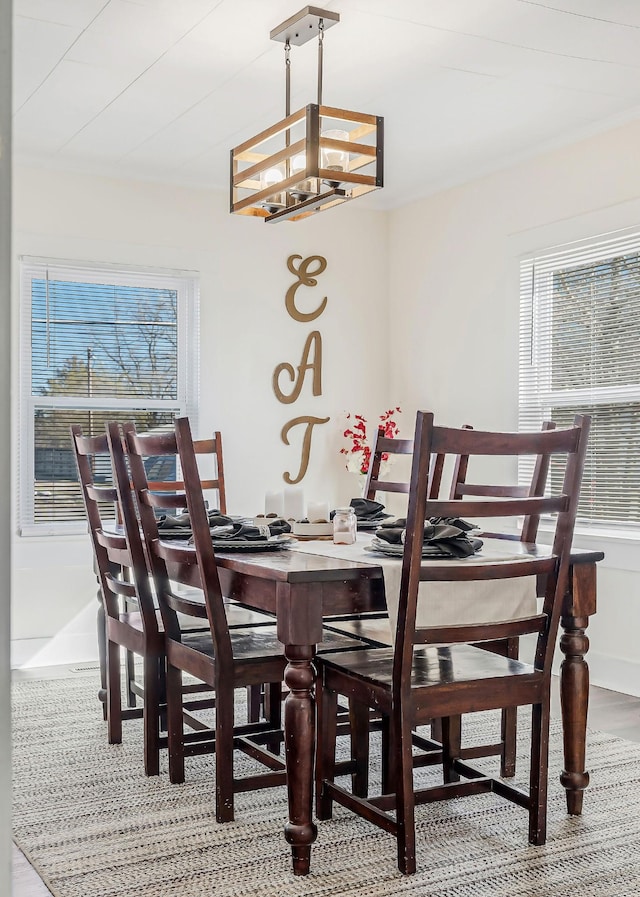 dining space with an inviting chandelier and plenty of natural light