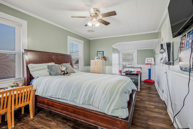 bedroom with ornamental molding, ceiling fan, and wood finished floors