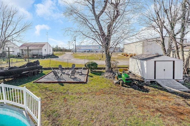 view of yard featuring a shed and an outbuilding