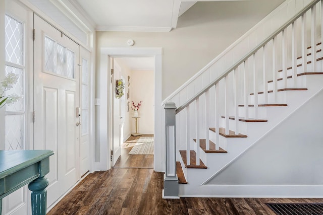 entryway featuring stairway, baseboards, and dark wood-type flooring