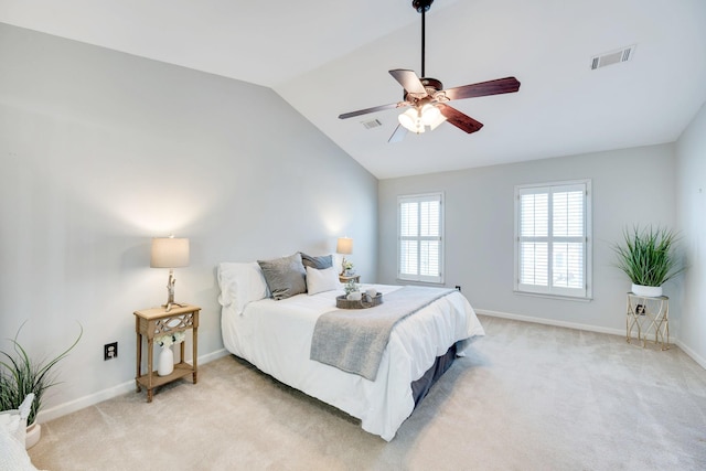 bedroom with lofted ceiling, visible vents, light carpet, ceiling fan, and baseboards