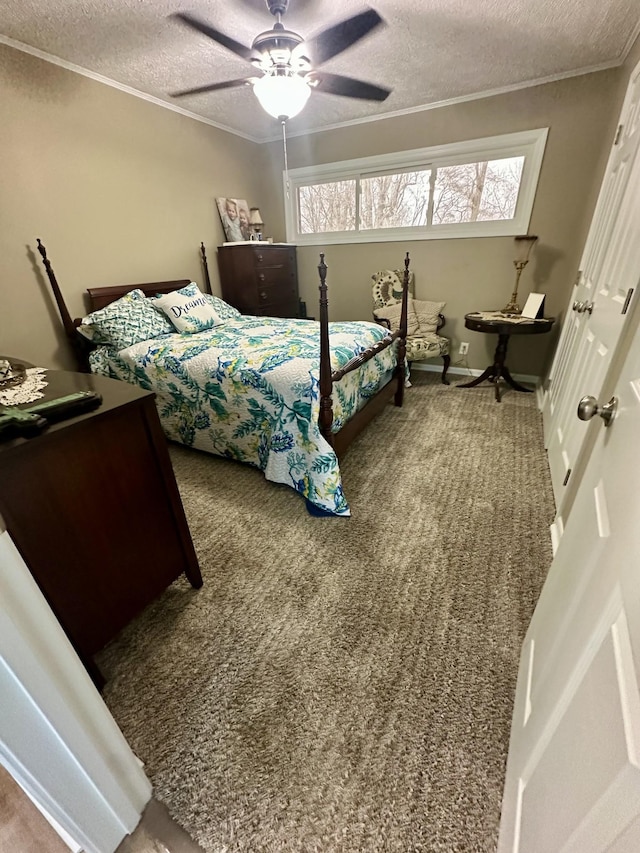 carpeted bedroom featuring a ceiling fan, ornamental molding, and a textured ceiling