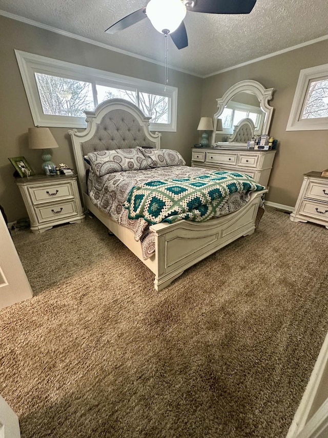 bedroom with a textured ceiling, a ceiling fan, baseboards, dark carpet, and crown molding