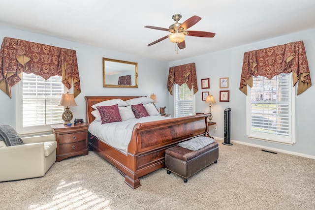 bedroom featuring carpet, visible vents, ceiling fan, and baseboards