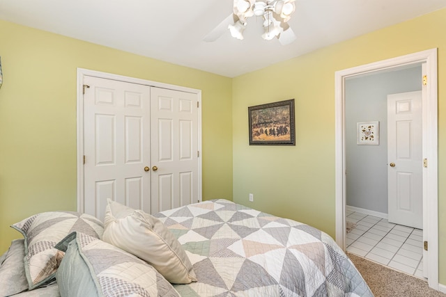 bedroom with ceiling fan, carpet floors, a closet, and baseboards