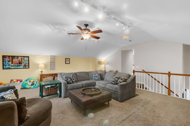 living area featuring vaulted ceiling, carpet floors, a ceiling fan, and track lighting