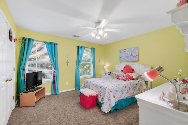 carpeted bedroom featuring visible vents, ceiling fan, and baseboards