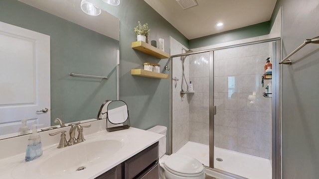 full bathroom featuring visible vents, a shower stall, toilet, and vanity