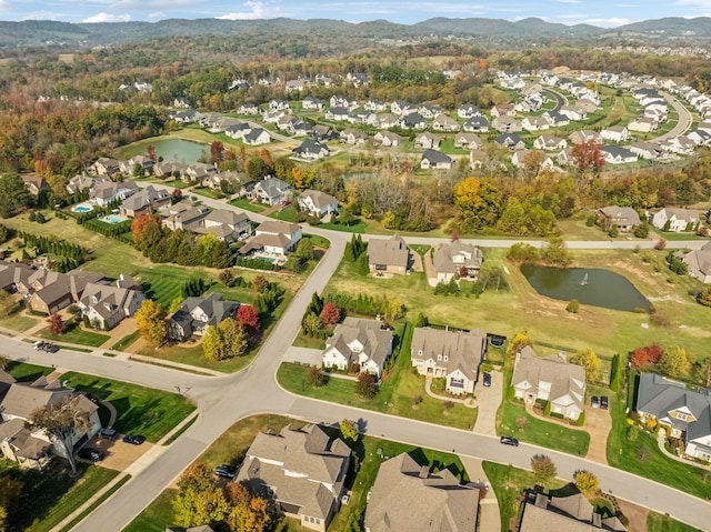 bird's eye view with a residential view and a water view